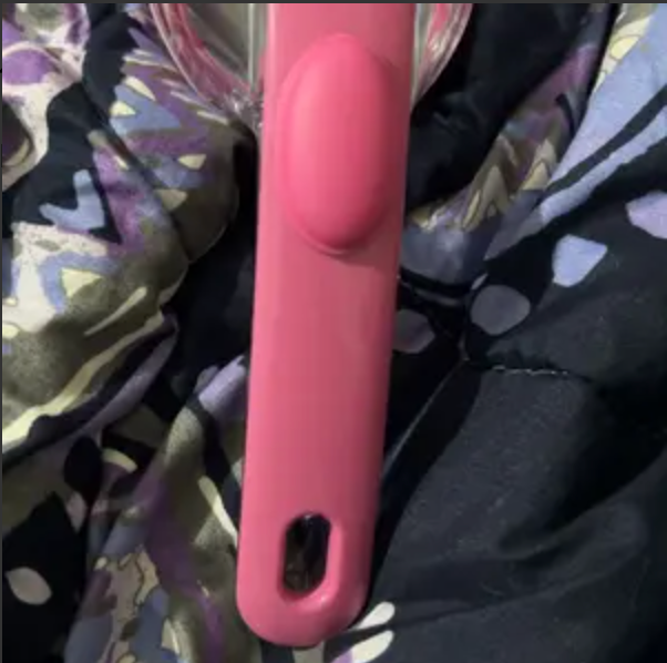 Close-up of the pink PawSuds brush handle