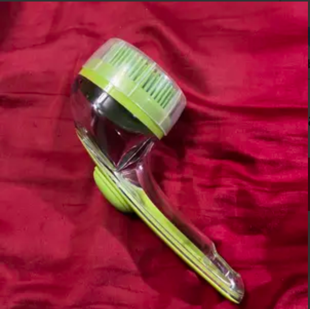 Customer's green PawSuds brush